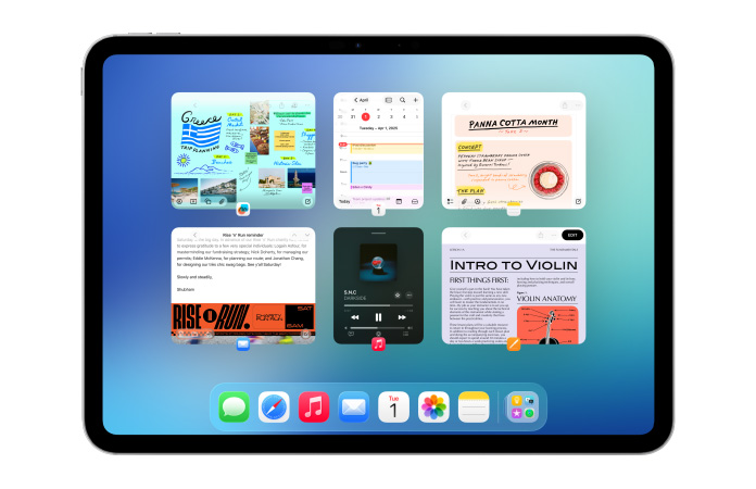 iPad, horizontale stand, scherm toont meerdere apps zoals Agenda en Muziek in zes vensters ingedeeld in twee rijen zodat de vensters dezelfde grootte krijgen