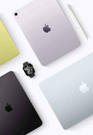 Vue de dessus d’appareils Mac et iPad de différentes couleurs, avec une Apple Watch noire au centre.