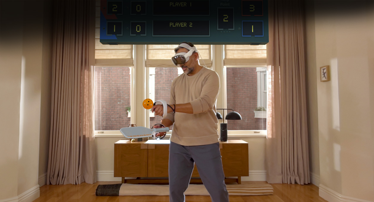 Man wearing Apple Vision Pro and Sony PlayStation VR2 Sense Controller playing Pickle Pro game, spatial scoreboard above his head
